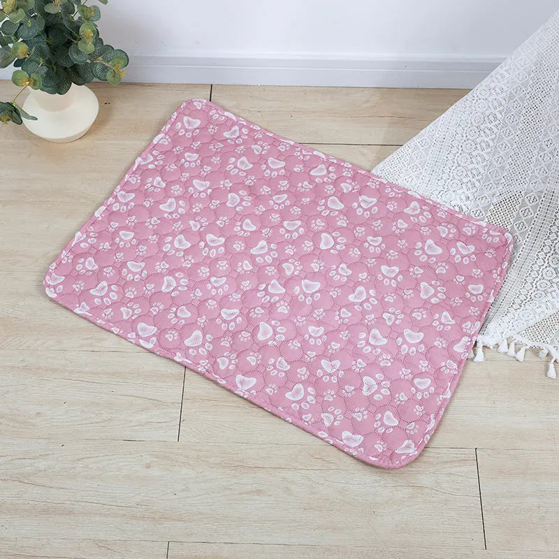 Reusable cloth pet urine pad with animal print and waterproof non-slip backing in various sizes.