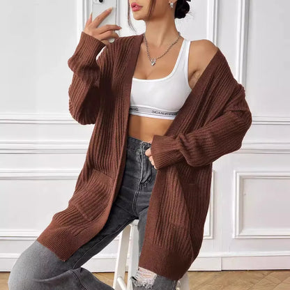 Women's dark green cardigan with two front pockets, 65cm length, loose fit design with long sleeves