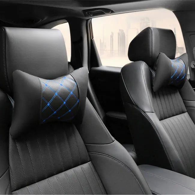 Leather quilted car headrest in black with blue lines, showing diamond check pattern and cervical neck support design.