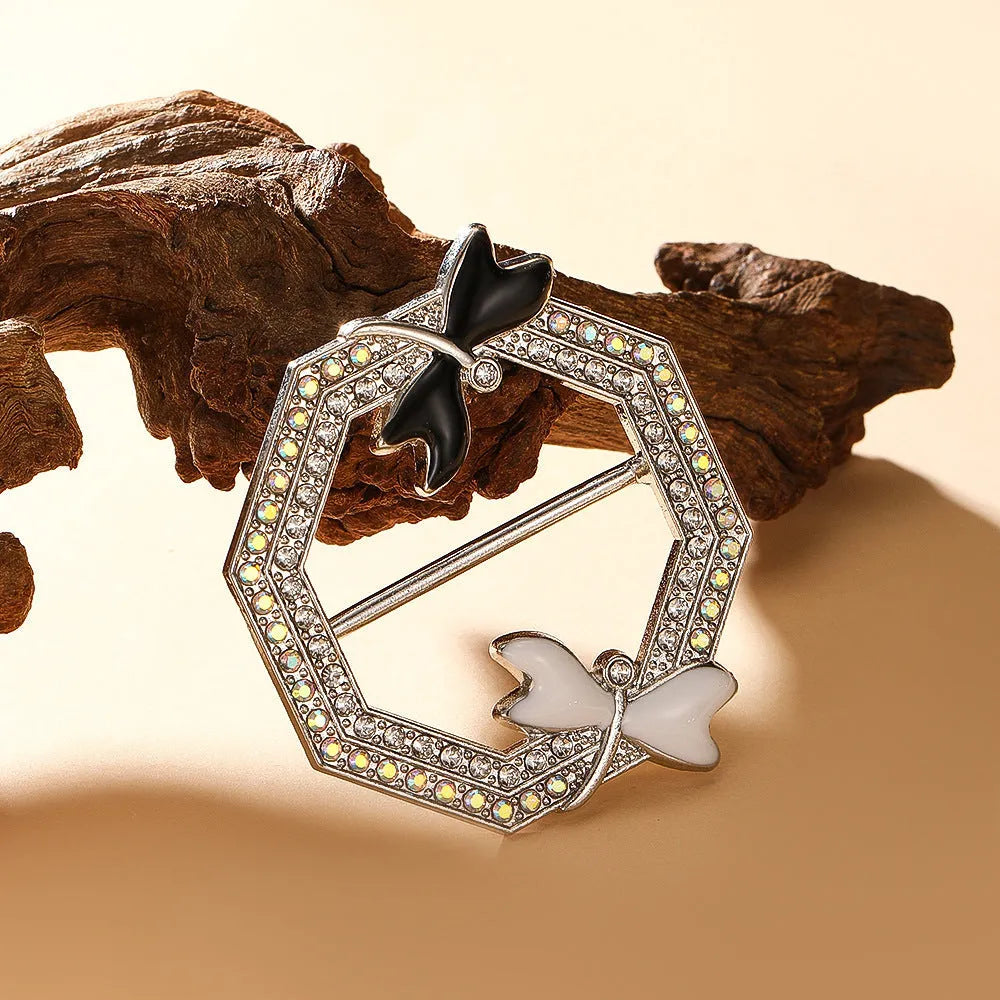 Bow-shaped waist-cinching accessory clip for high-end brooches, alloy with electroplating and diamond inlay, shown in gold, silver, or rose gold finishes.