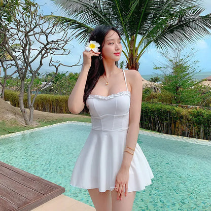 White women's one-piece swimsuit with hollow out detailing on mannequin