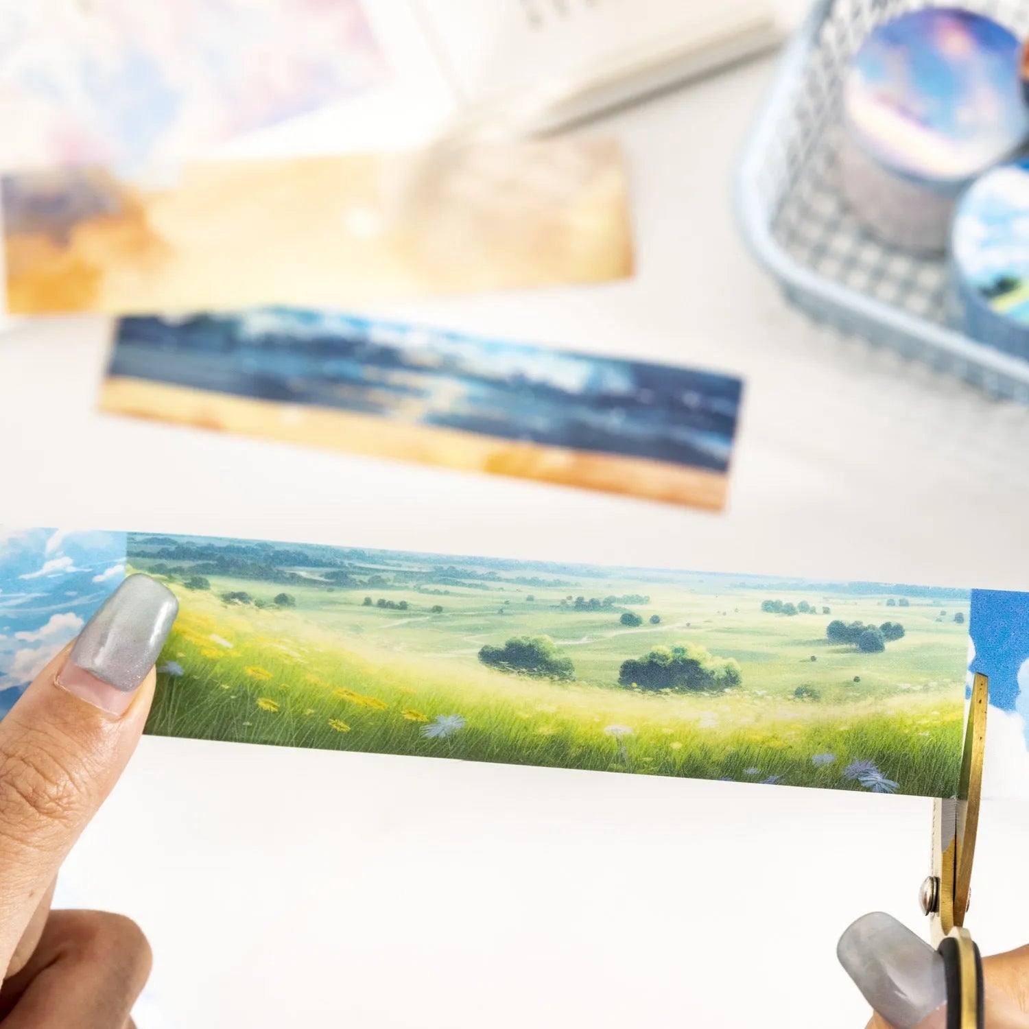 Roll of Japanese paper sky theme washi tape showing colourful clouds design, 30mm width