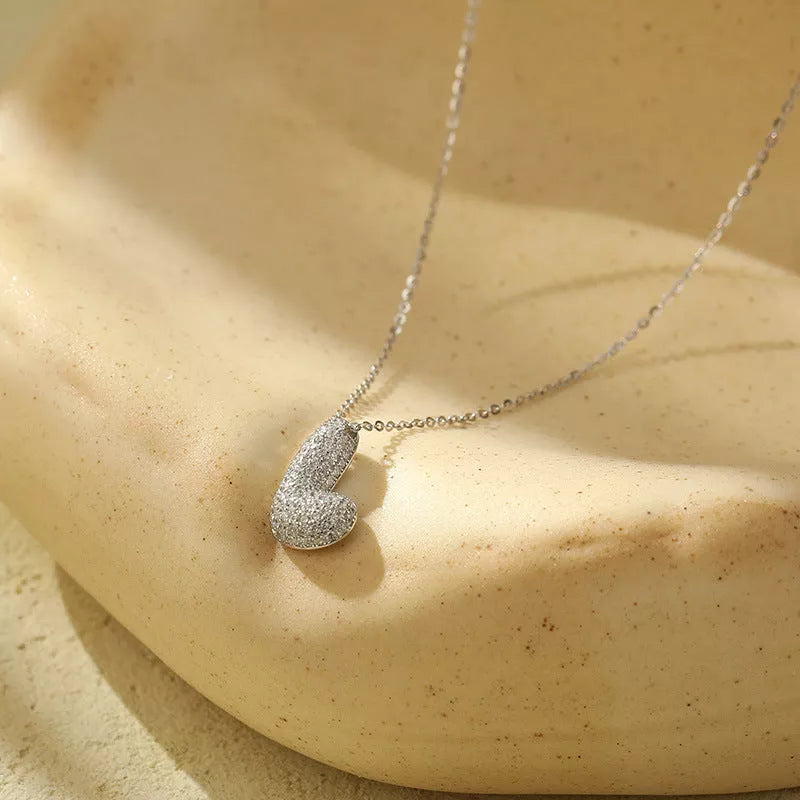 Stainless steel initial pendant necklace with zircon accents, personalized with your choice of letter.