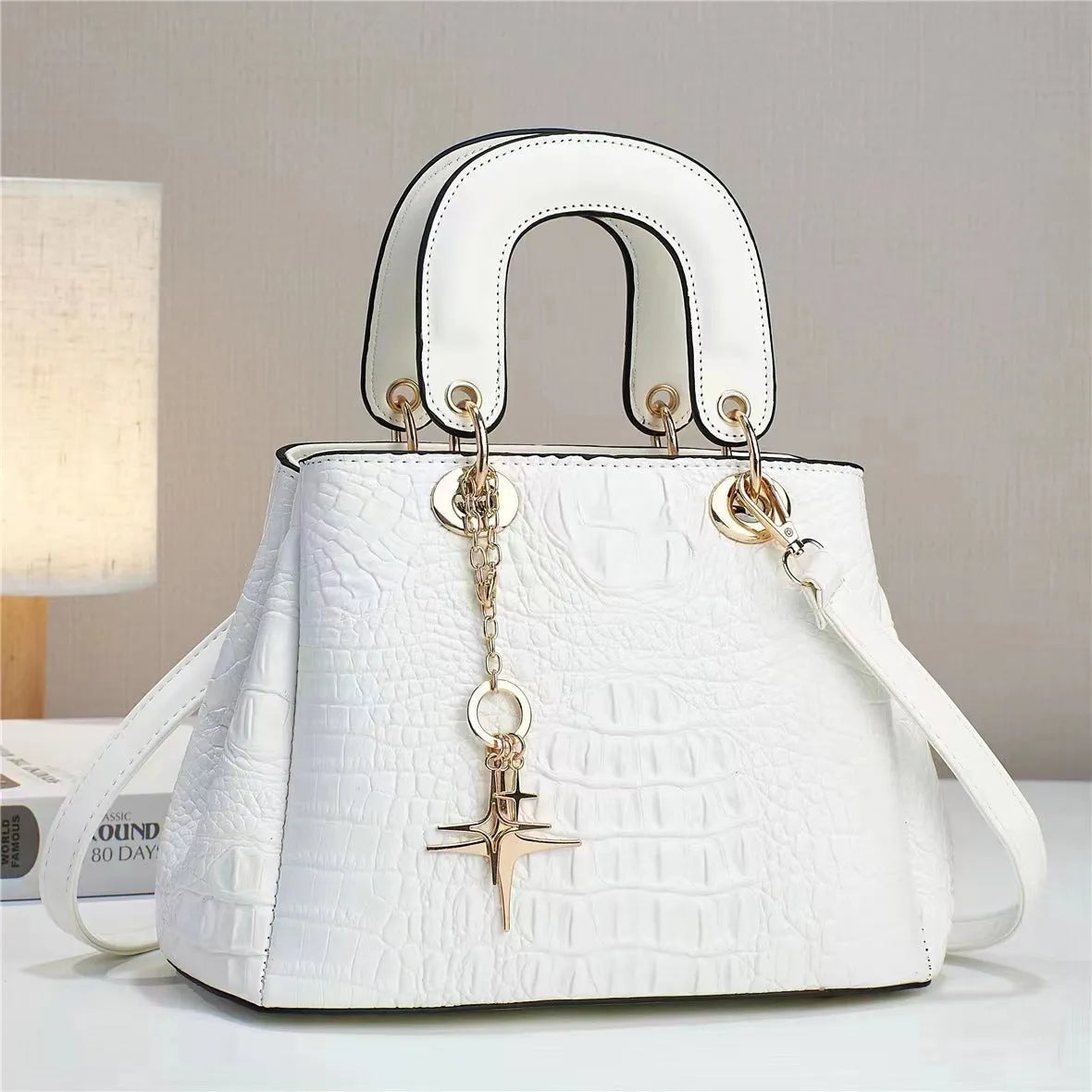 Women's PU shoulder bag with single strap, horizontal square shape, embossed finish and zip change pocket in beige