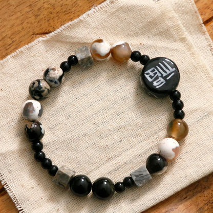 Hand-woven natural black agate ceramic bracelet with geometric design and round elements