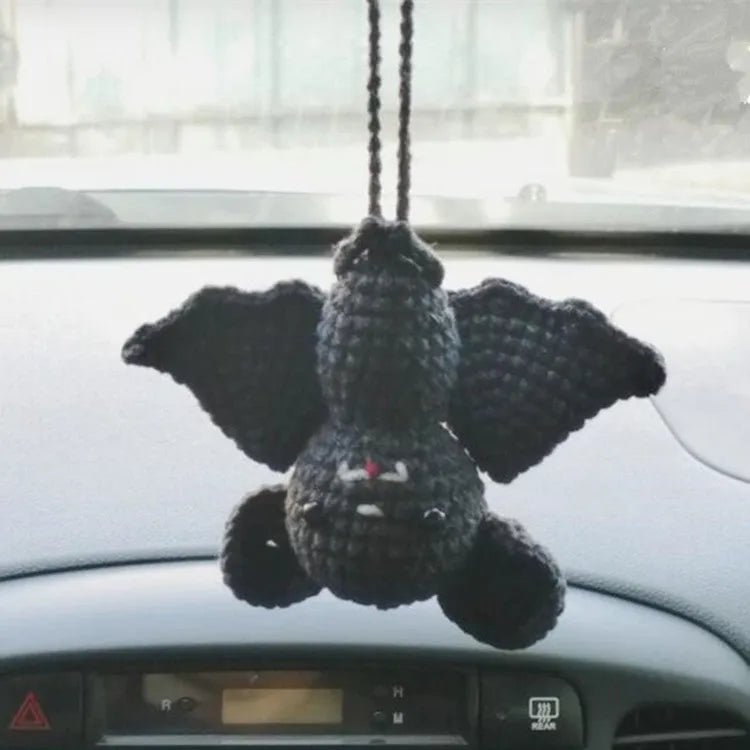 Soft, hand-woven plush car hanging ornament in a cartoon character design.