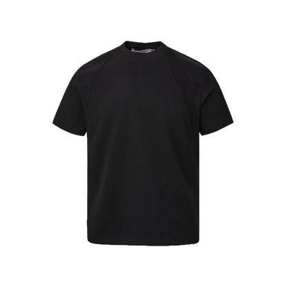 Man's loose fit black short sleeve top with textured air layer stitching detail.