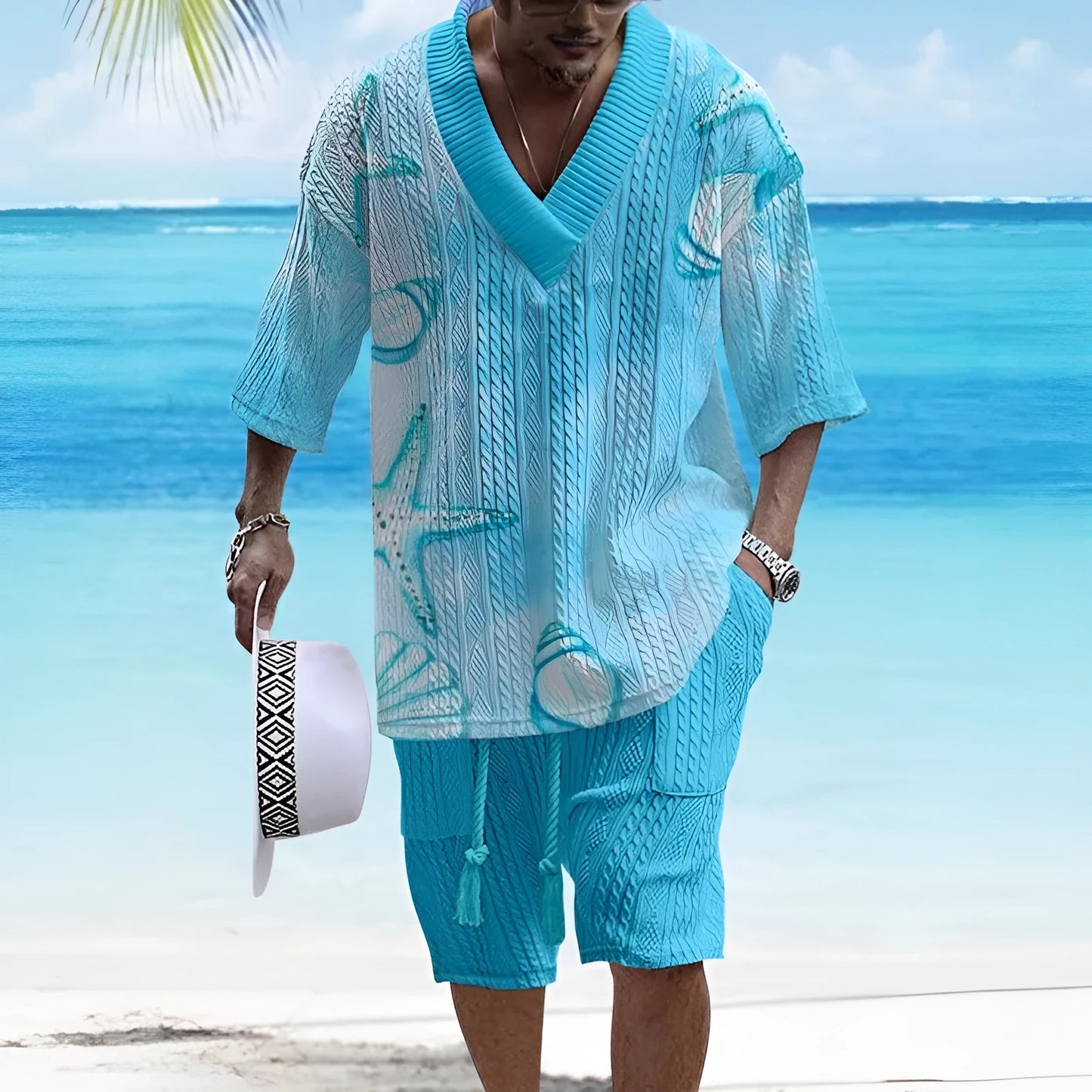 Man wearing a loose blue short sleeve suit jacket and matching casual shorts.