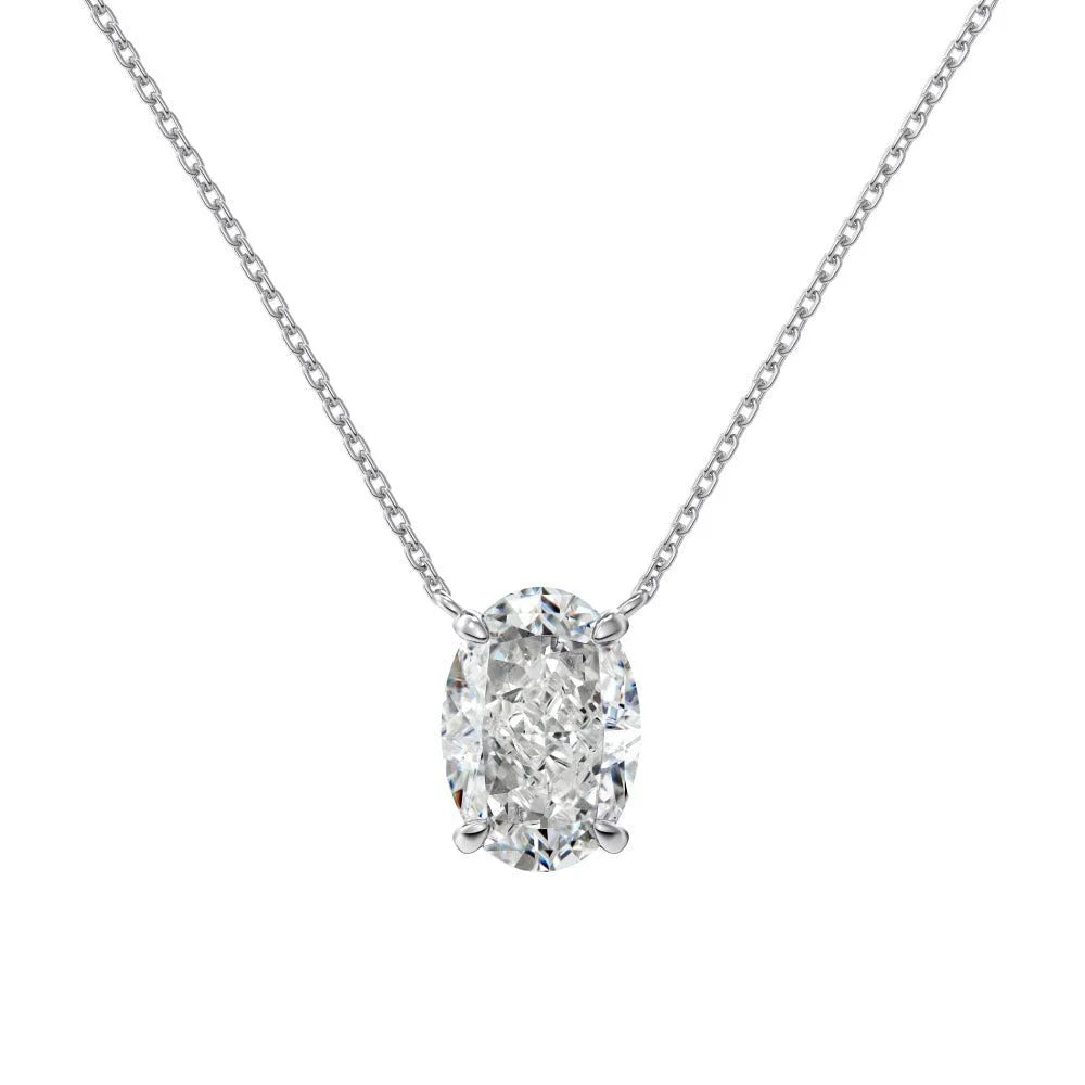 Close-up of a geometric oval ice flower pendant necklace in sterling silver with a choice of platinum or gold tone finish.