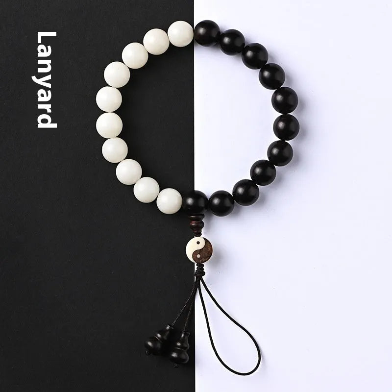 Handmade bodhi seed bracelet with eight-diagram pattern in white and blackwood beads