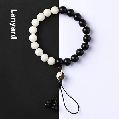 Handmade bodhi seed bracelet with eight-diagram pattern in white and blackwood beads