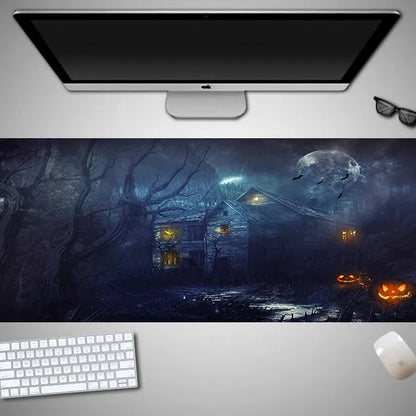 Oversized black mouse pad with Halloween-themed graphic, shown on a wooden desk with keyboard and gaming mouse.