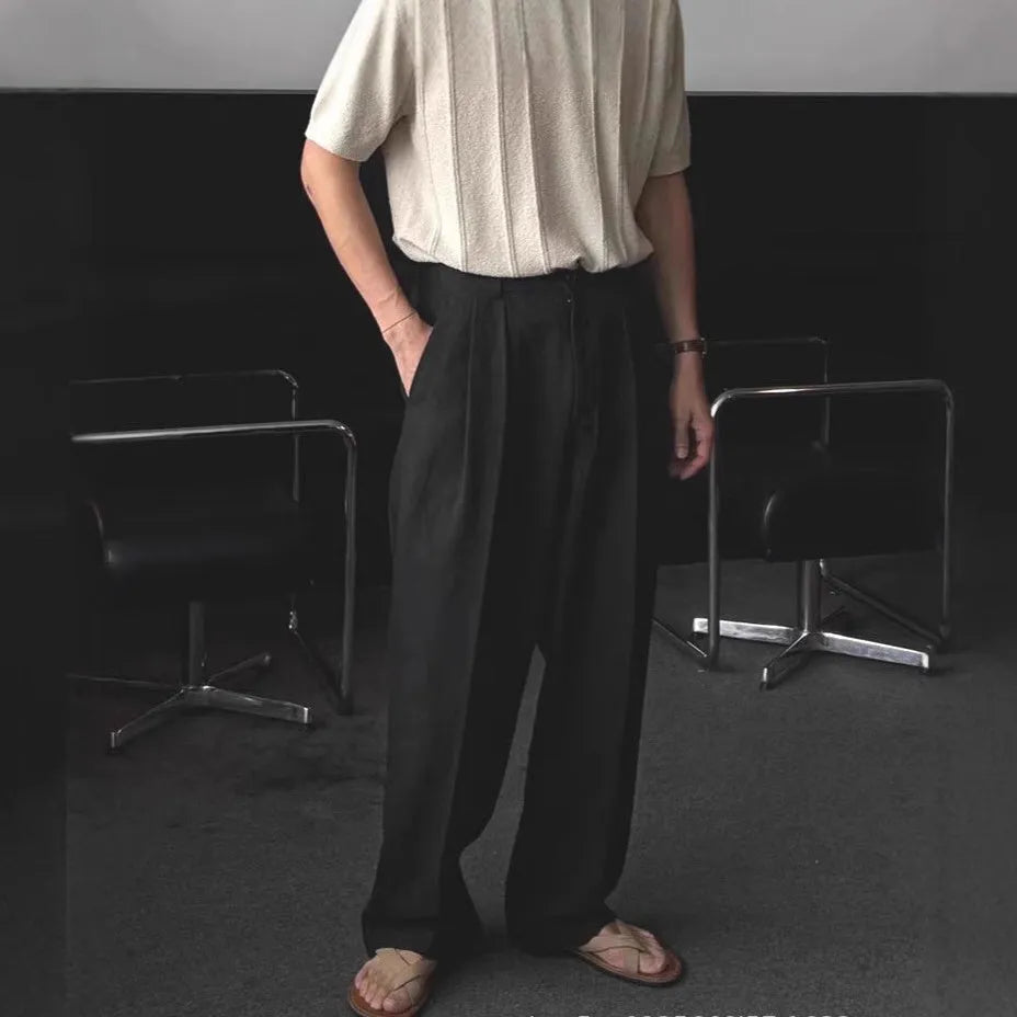 Men's apricot cotton linen trousers with elastic waistband and pencil leg opening on hanger