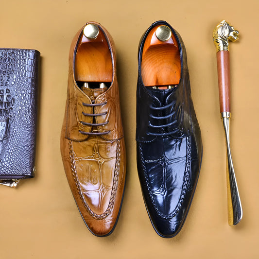 Men's black alligator pattern leather shoes with a horse bit buckle and rubber sole.