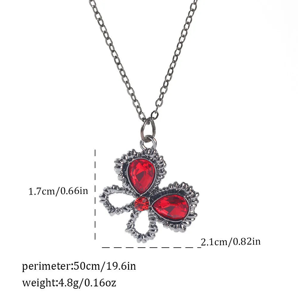 Gothic style zinc alloy necklace with bat pendant on a silver chain against dark background.