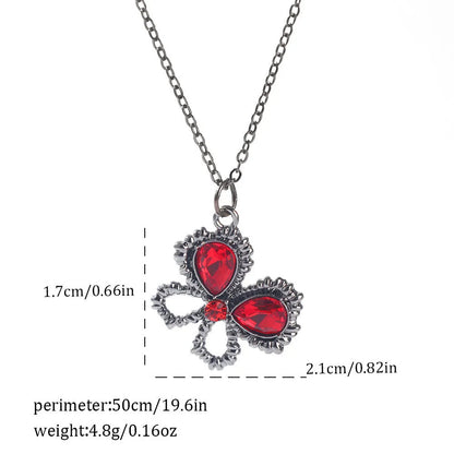 Gothic style zinc alloy necklace with bat pendant on a silver chain against dark background.