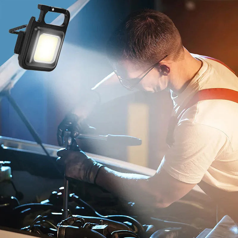 Black aluminium alloy USB rechargeable keychain light with magnetic base and foldable handle