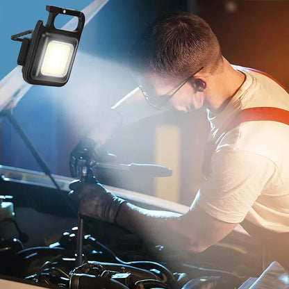 Black aluminium alloy USB rechargeable keychain light with magnetic base and foldable handle