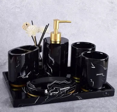 Ceramic bathroom set with bright glaze showing emulsion bottle, cup, toothbrush holder and soap dish