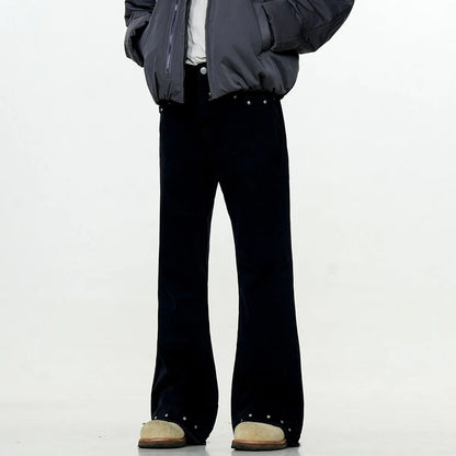 Pair of black straight-leg skinny jeans with a mid-rise waist and zipper fly on a neutral background.