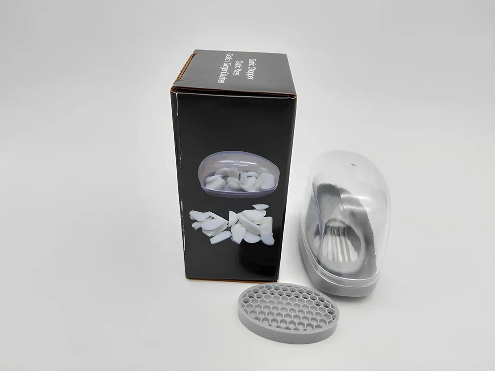 White plastic garlic cutter with stainless steel blades measuring 11cm long