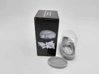 White plastic garlic cutter with stainless steel blades measuring 11cm long