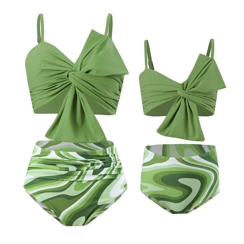 Women's big bow print bikini and swim trunks set in nylon fabric showing colour options