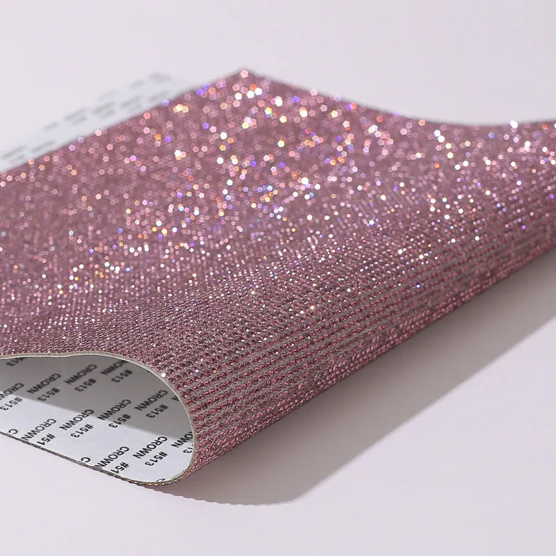 Rhinestone sticker net on backing sheet for hot drilling application to fabrics in multiple colour options