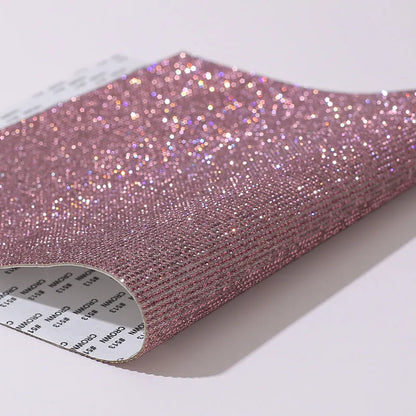 Rhinestone sticker net on backing sheet for hot drilling application to fabrics in multiple colour options