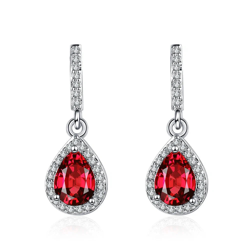 Elegant drop-shaped earrings featuring shimmering zircon stones in a variety of colors, including white, yellow, blue, and red diamond.