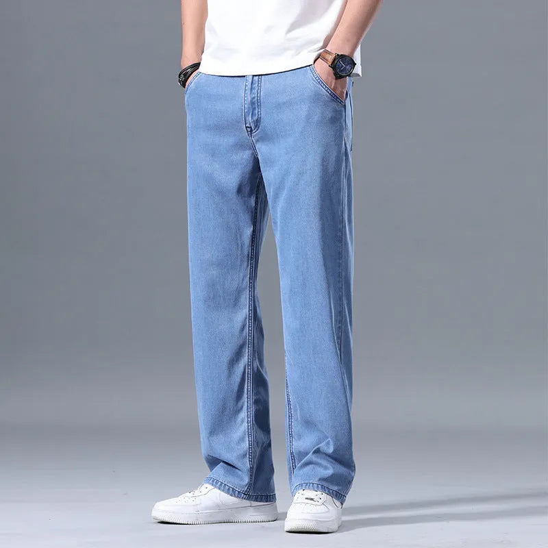 Man wearing light blue loose-fit straight-leg lyocell blend casual jeans.