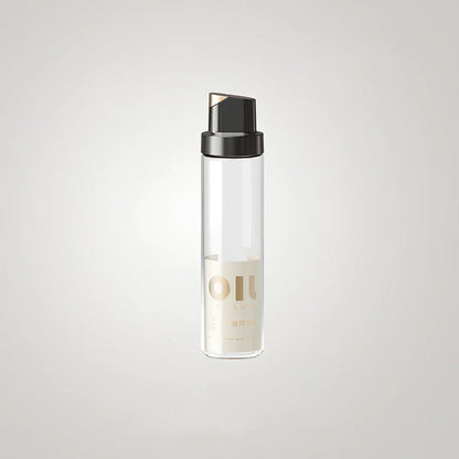 Transparent glass oil kettle with automatic gravity sensor mechanism in kitchen setting