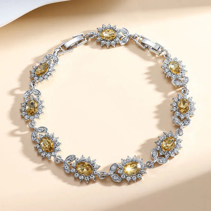 Personality Trend women's simple bracelet with inlaid zircon stones in a choice of nine gemstone colours on a wrist.