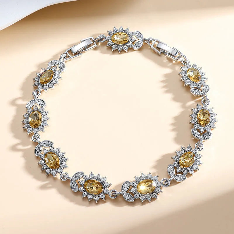 Personality Trend adjustable alloy bracelet with inlaid zircon stones in a choice of nine gemstone colours on a wrist.