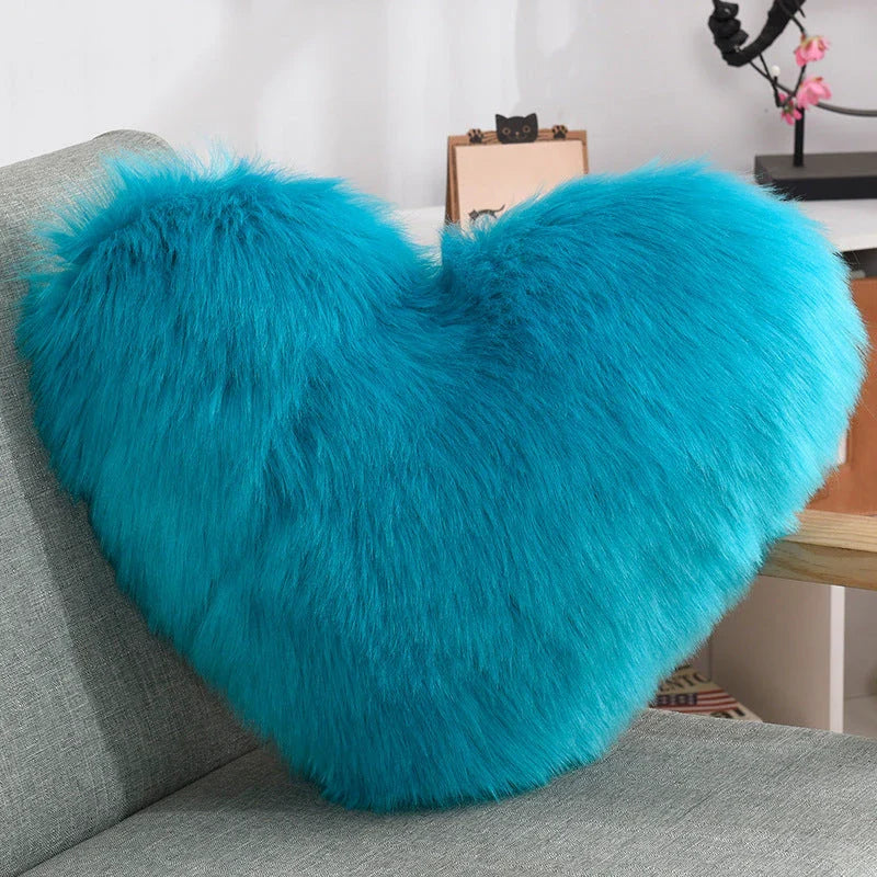 Cozy heart-shaped plush throw pillows in various colors and sizes for living room and bedroom decor
