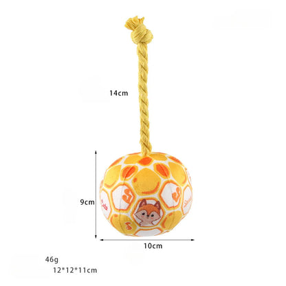 Blue and yellow elastic football dog toy with an attached cotton rope for tug of war and chewing.