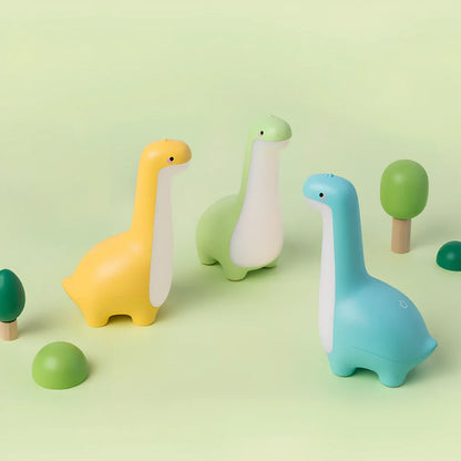 Dinosaur-shaped children's night light in lemon yellow with USB charging cable and 3000K warm white illumination