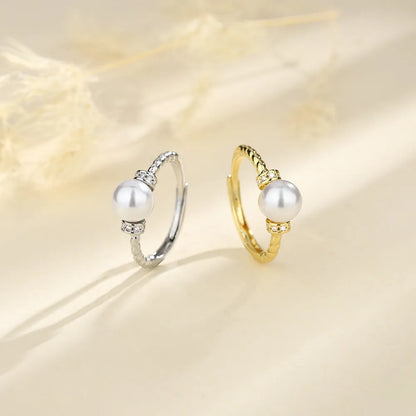 Adjustable copper ring with pearl inlay in geometric twist design, gold or silver finish