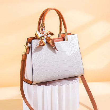 Milky white women's large shoulder handbag with interior organiser pockets and horizontal square shape.