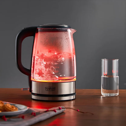 Transparent glass electric kettle showing water level scale and ergonomic handle
