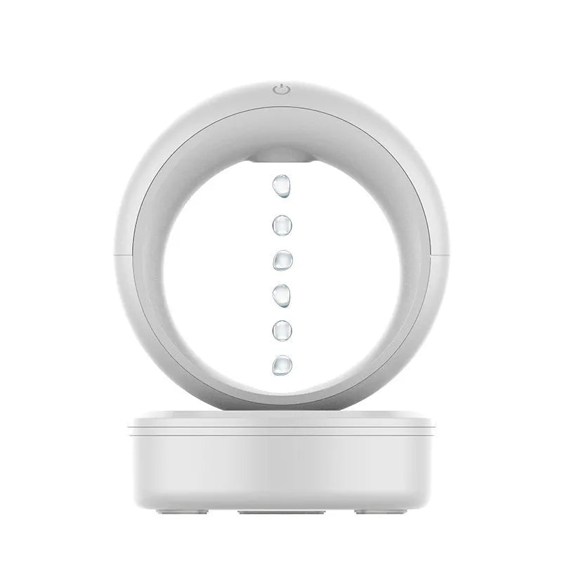 White round USB-powered anti-gravity humidifier creating optical illusion of levitating water droplets
