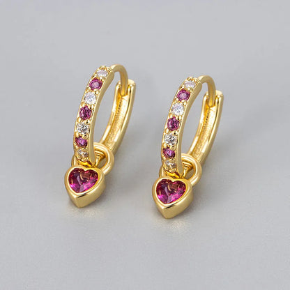 Fashion zircon earrings with 10mm heart-shaped drops in gold and white gold settings, showing diamond-treated stones