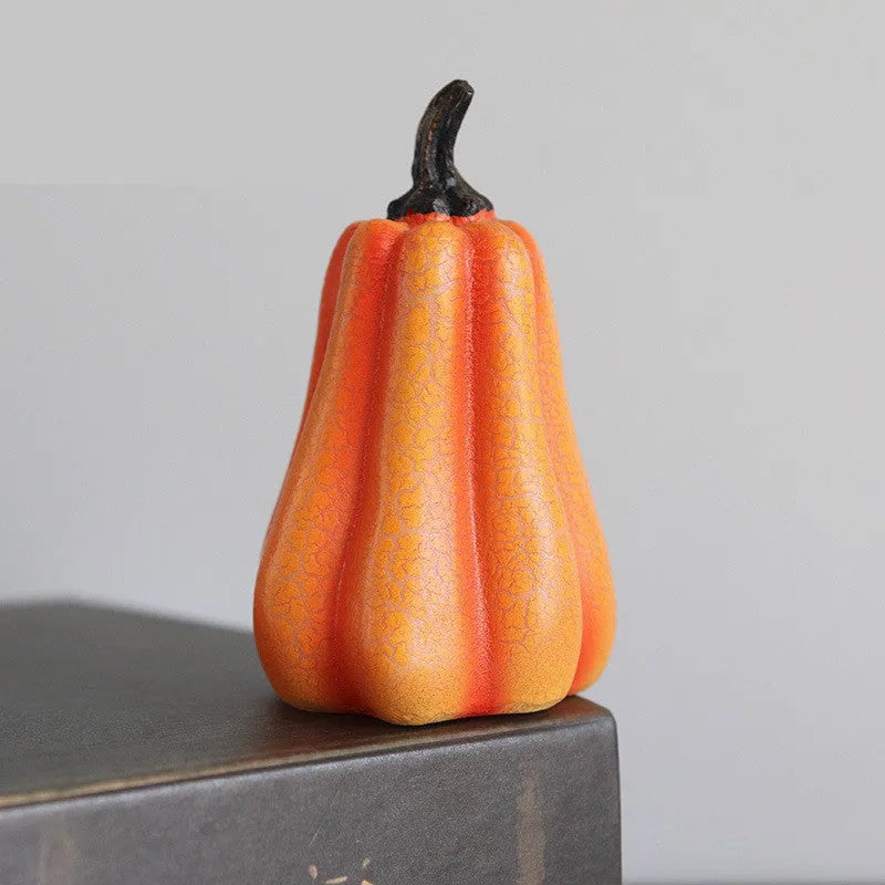 Set of three resin Halloween pumpkin lanterns with LED lights in long, medium, and short sizes.