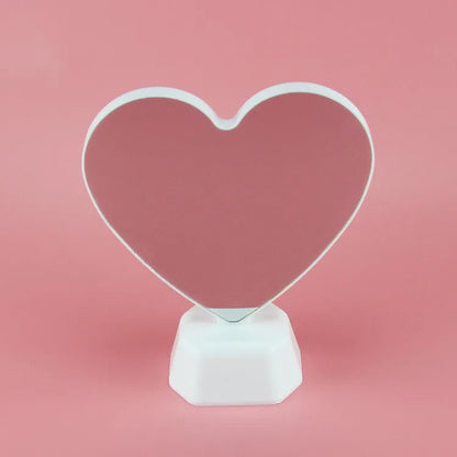 Double-sided LED love tunnel light with rose red illumination on a plastic base.
