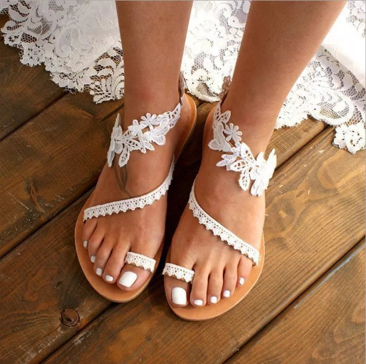 Bohemian lace sandals with floral ankle strap in white and black