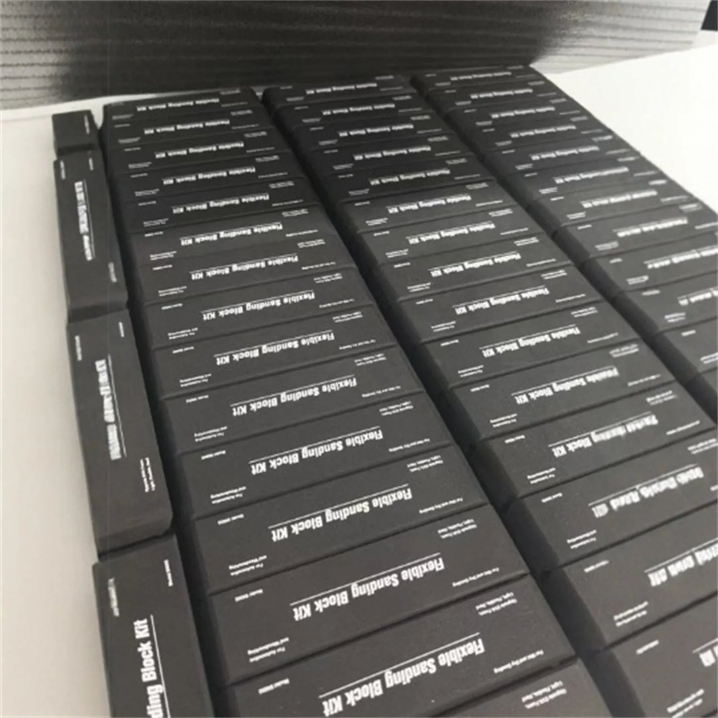 Seven black frosted metal EVA blocks arranged together, each measuring 20mm by 20mm by 10mm.