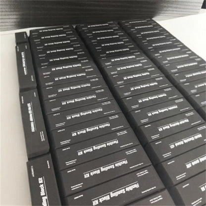 Seven black frosted metal EVA blocks arranged together, each measuring 20mm by 20mm by 10mm.