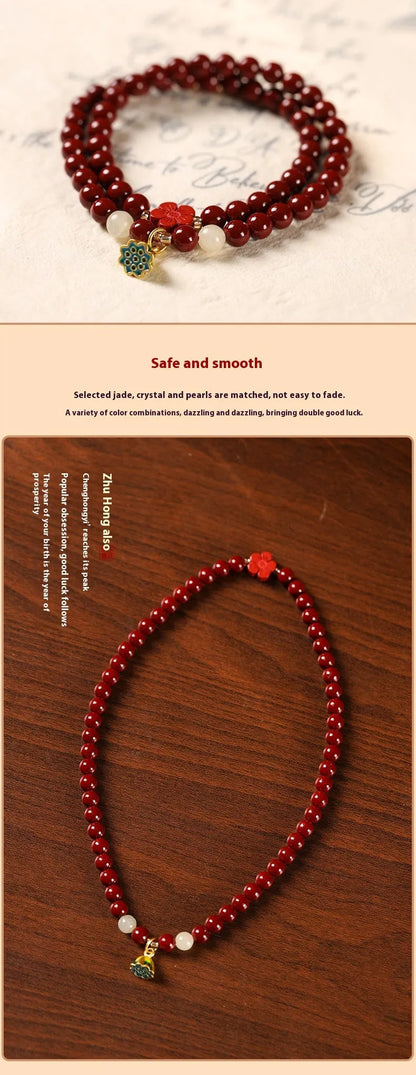 Close-up of a hand-woven purple gold cinnabar bead bracelet with a lotus seedpod charm.
