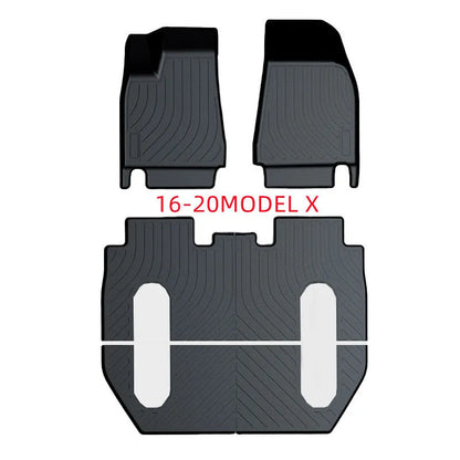 Black TPE rubber floor mats for Tesla Model 3, showing deep grooves and raised edges on driver's side.