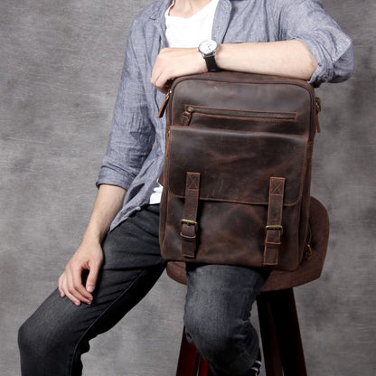 Dark coffee coloured retro leather backpack made from first layer cowhide with organised interior pockets.